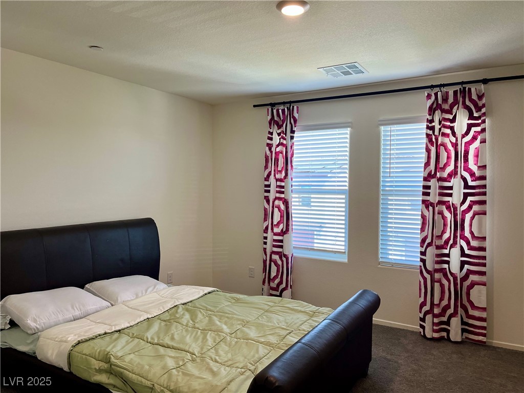 4862 Orchid Rdg Avenue Las Vegas, NV 89141 - Photo 19 of 48 Primary bed w/ceiling light, blinds & curtains, carpet & walk in closet.