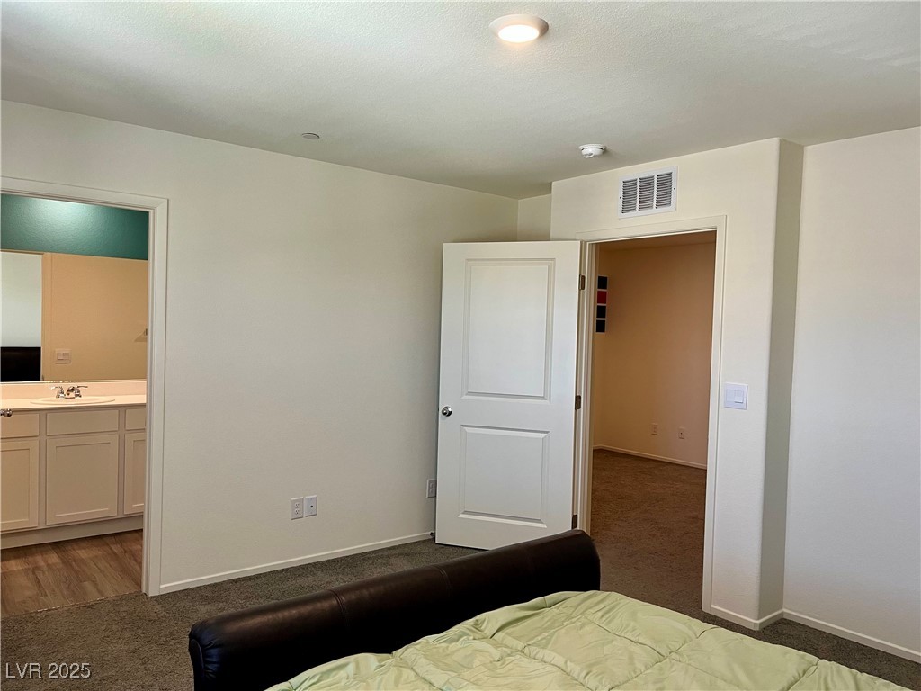 4862 Orchid Rdg Avenue Las Vegas, NV 89141 - Photo 21 of 48 Primary bed w/ceiling light, blinds & curtains, carpet & walk in closet.