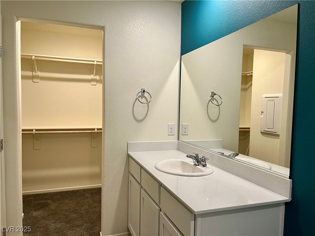 4862 Orchid Rdg Avenue Las Vegas, NV 89141 - Photo 25 of 48 Primary bath w/quartz counters, white shaker cabinets & walk in shower.