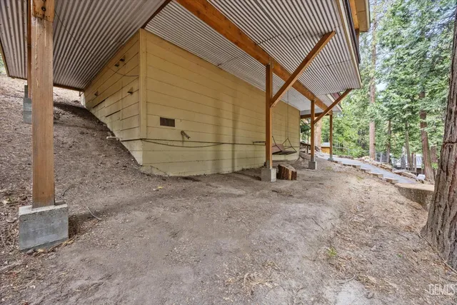 a view of roof deck with wooden fence and floor