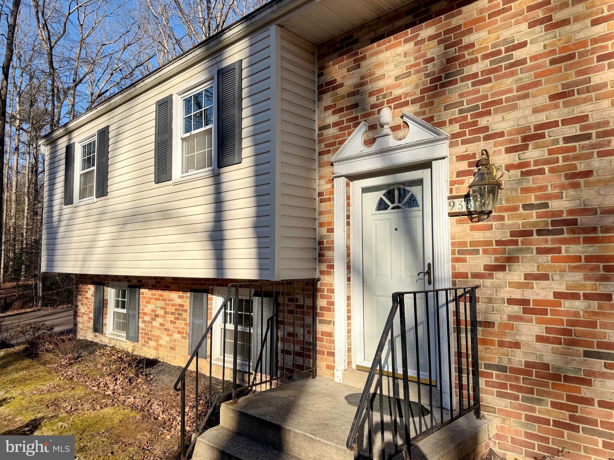 9350 Mathir Drive La Plata, MD 20646 - Photo 12 of 44 a front view of a house with wooden stairs