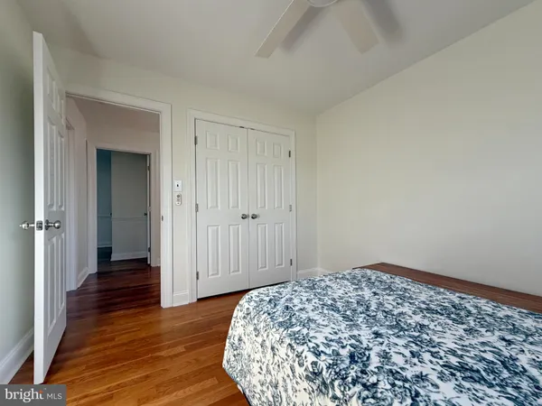 a view of hallway with wooden floor