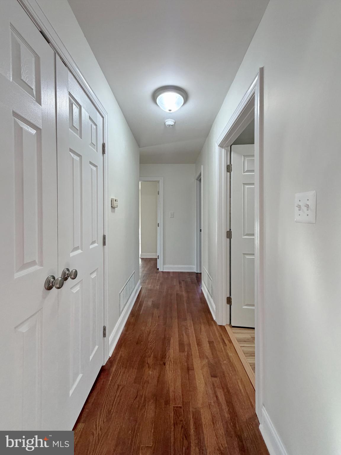 9350 Mathir Drive La Plata, MD 20646 - Photo 17 of 44 a view of a hallway with wooden floor and staircase