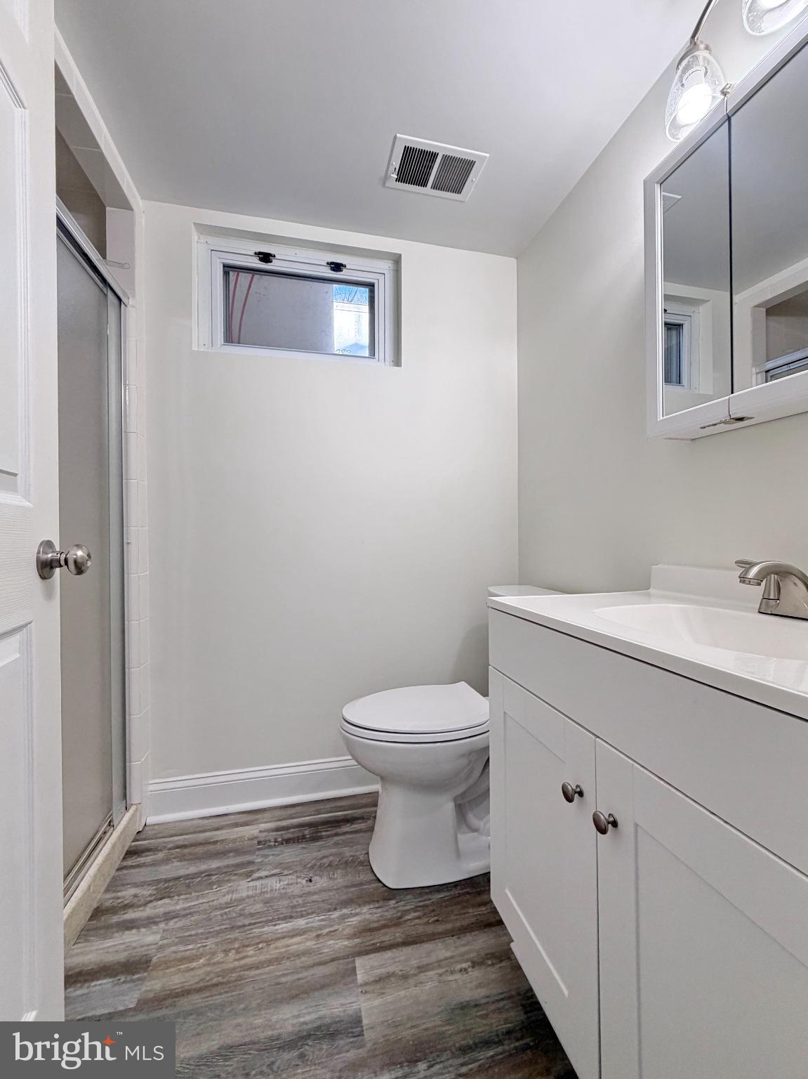9350 Mathir Drive La Plata, MD 20646 - Photo 26 of 44 a bathroom with a toilet sink and mirror
