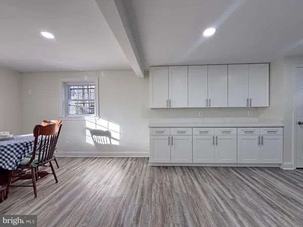 a view of a livingroom with furniture and wooden floor