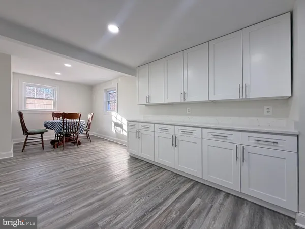 a kitchen with sink and cabinets