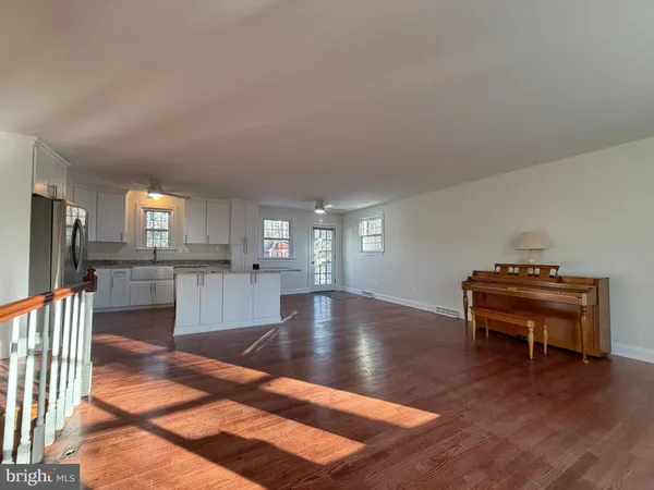 a view of kitchen with furniture and a fireplace