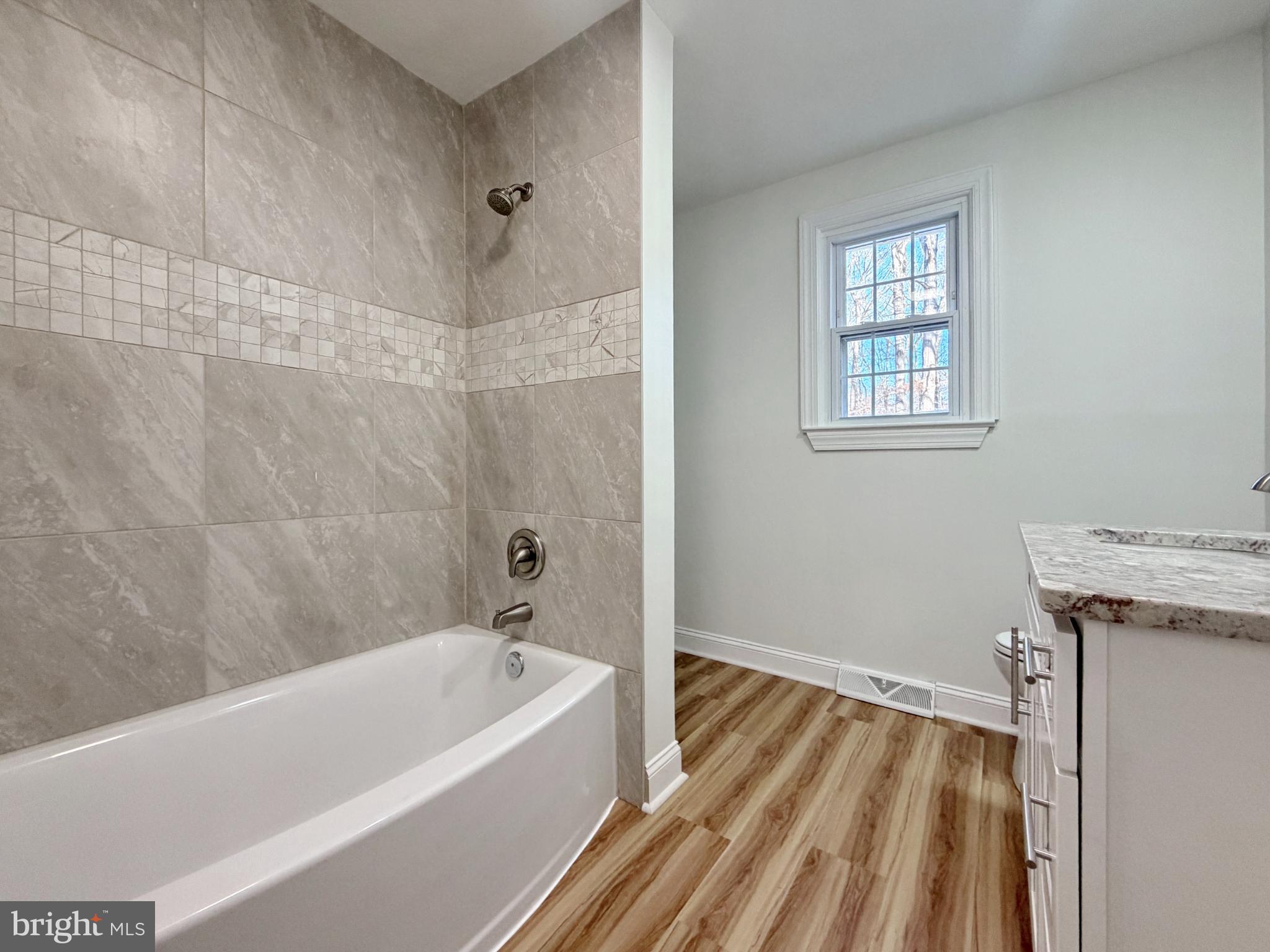 9350 Mathir Drive La Plata, MD 20646 - Photo 8 of 44 a bathroom with a bathtub and shower