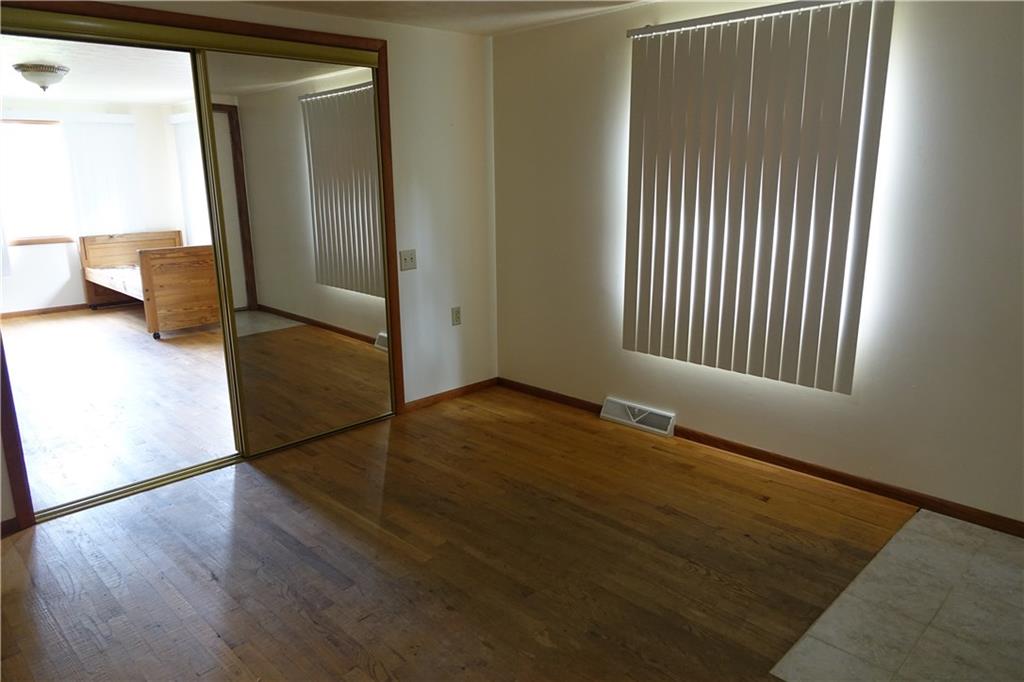 917 New Castle Road Butler, PA 16001 - Photo 14 of 25 Bedroom with hardwood flooring