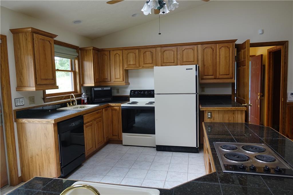 917 New Castle Road Butler, PA 16001 - Photo 5 of 25 Kitchen with ceramic tile flooring, abundant cabinetry and counter top space