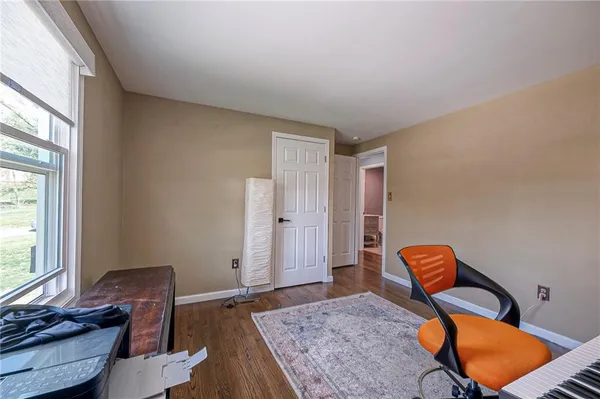 a workspace with furniture and window