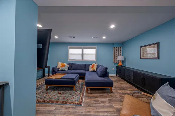 a living room with furniture and a window
