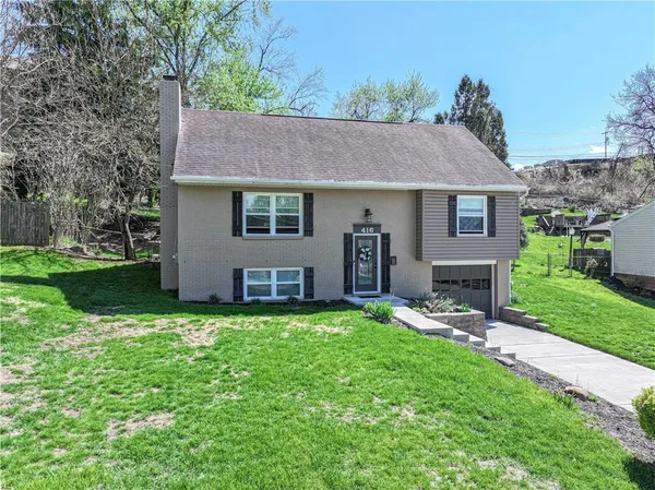 front view of a house with a yard