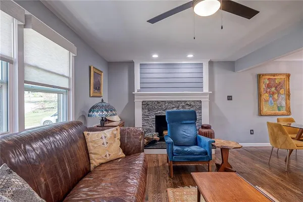 a living room with furniture and a fireplace