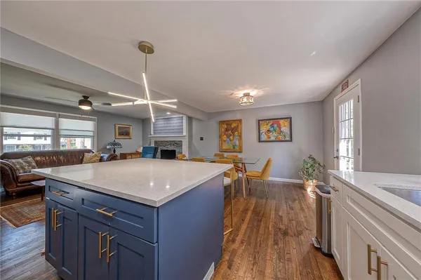a view of a kitchen wooden floor and living room