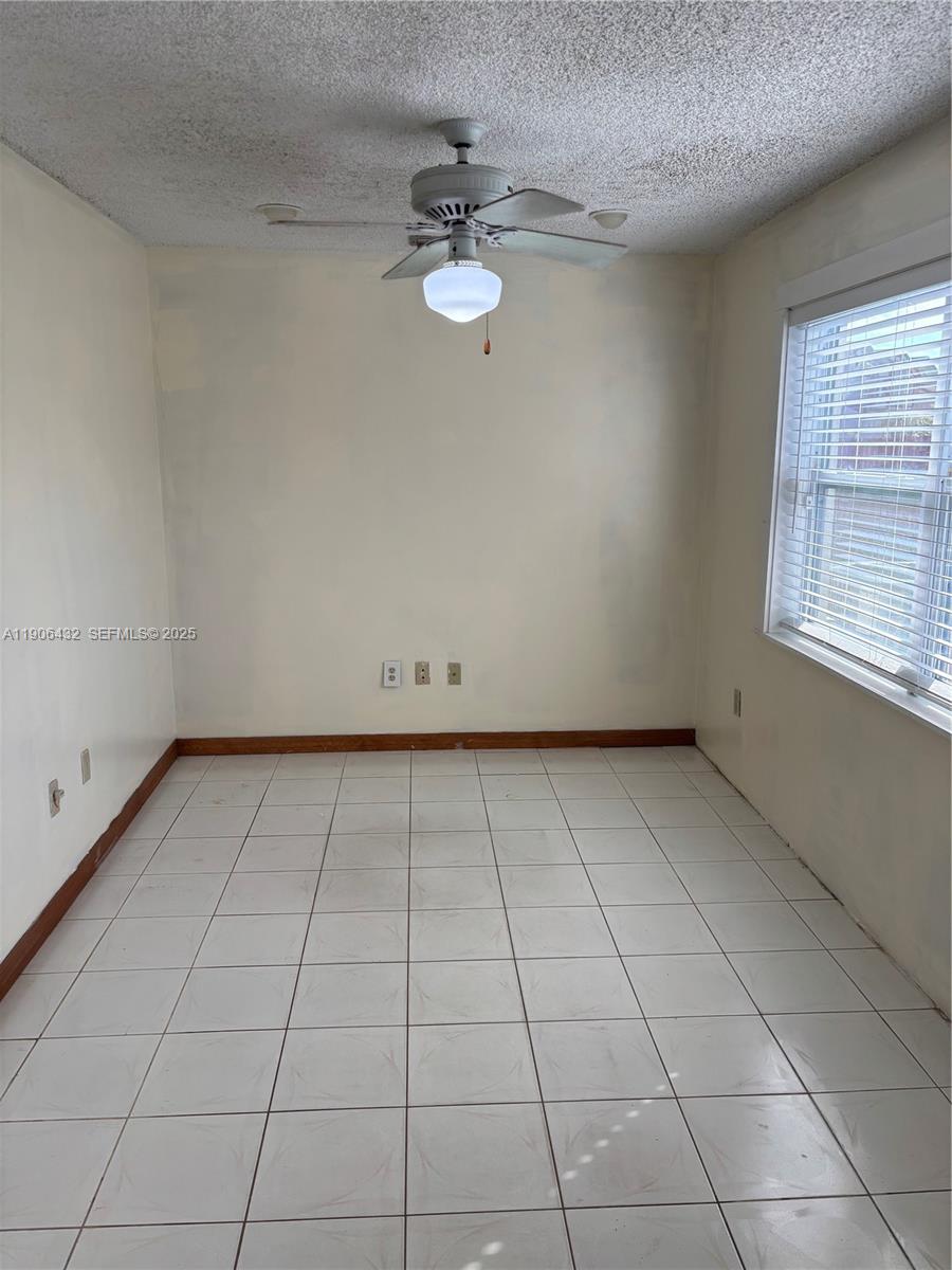 4314 Southwest 148th Court Miami, FL 33185 - Photo 16 of 32 a view of a livingroom with an empty space and a window