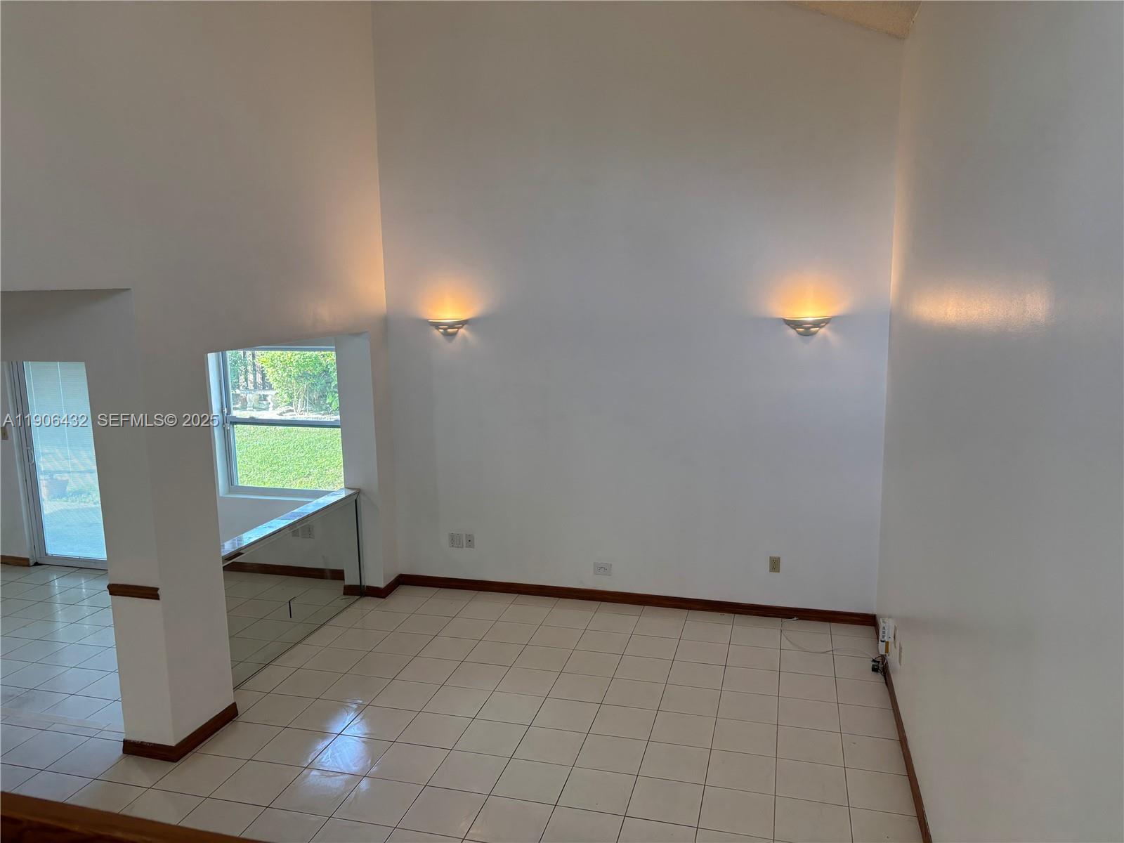 4314 Southwest 148th Court Miami, FL 33185 - Photo 7 of 32 a view of an empty room and window