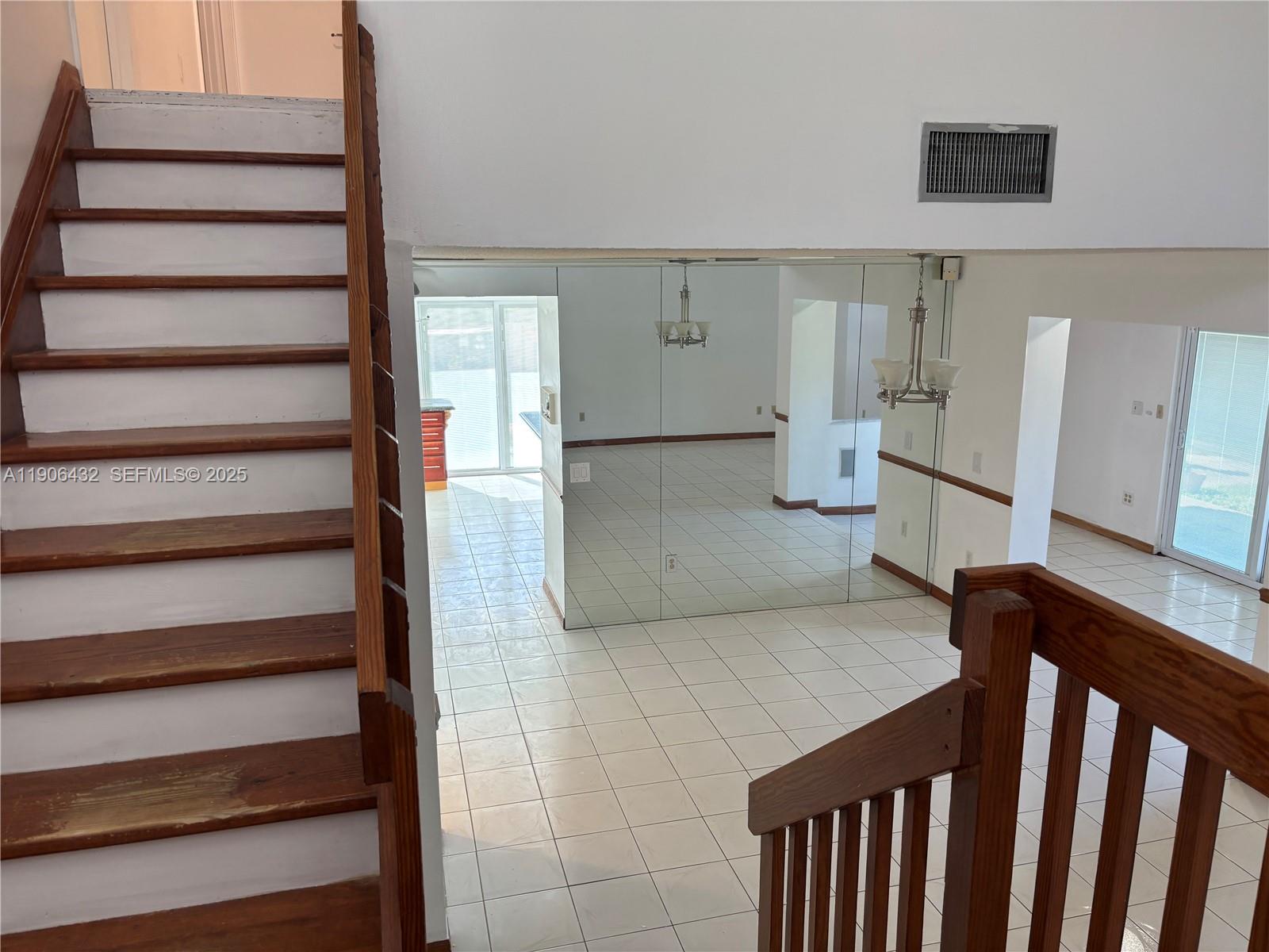 4314 Southwest 148th Court Miami, FL 33185 - Photo 8 of 32 a view of entryway and hall with wooden floor