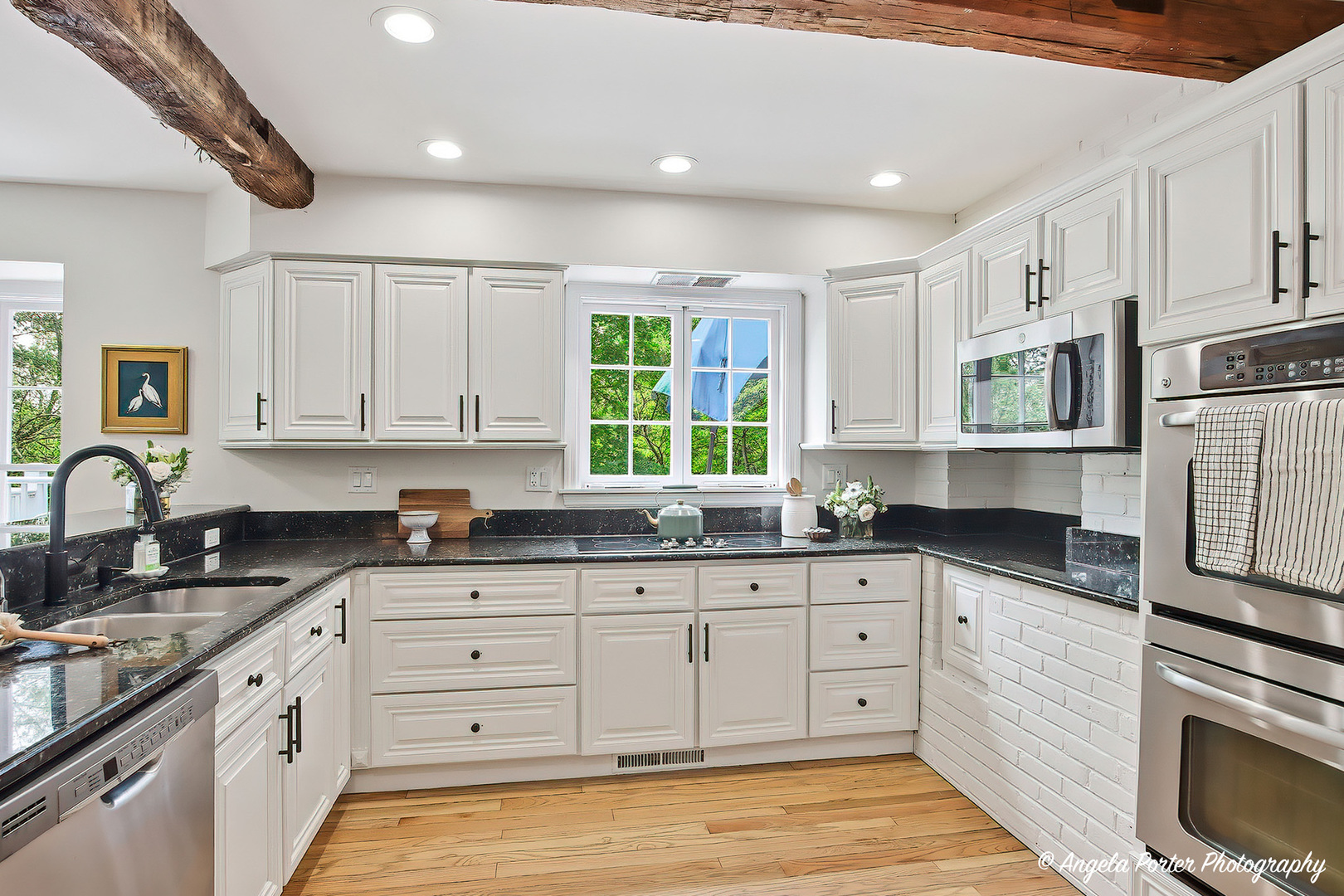 15 Willet Way Trout Valley, IL 60013 - Photo 17 of 61 a kitchen with granite countertop white cabinets and white appliances