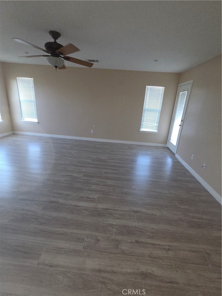 10141 Rochester Road Phelan, CA 92371 - Photo 21 of 22 wooden floor in an empty room with a window