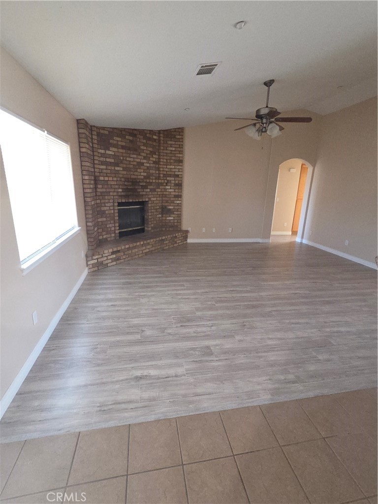 10141 Rochester Road Phelan, CA 92371 - Photo 6 of 22 wooden floor in an empty room with a window