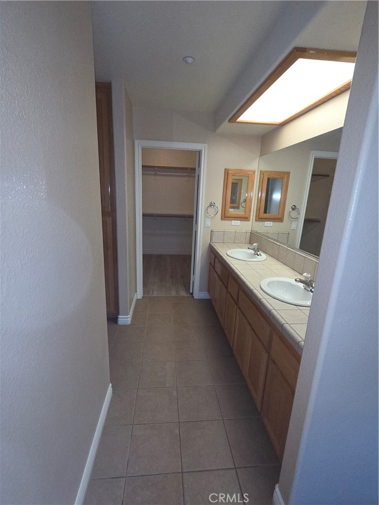 10141 Rochester Road Phelan, CA 92371 - Photo 7 of 22 a bathroom with a sink and a mirror