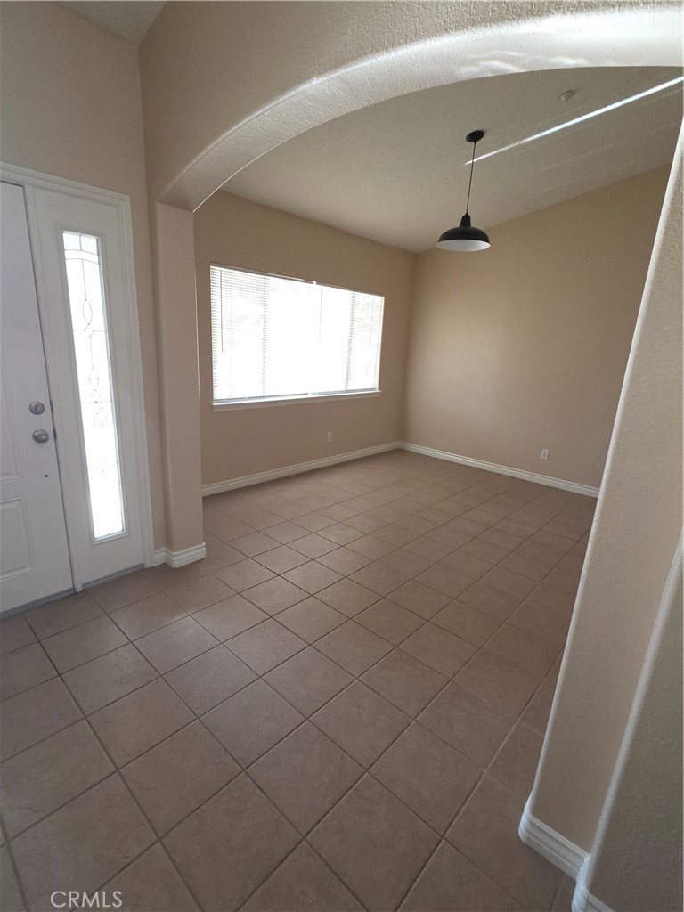 10141 Rochester Road Phelan, CA 92371 - Photo 10 of 22 a view of an empty room with a window
