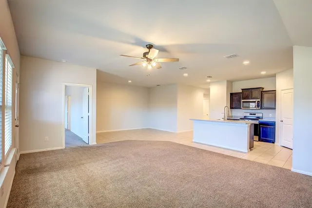 a view of kitchen and windows
