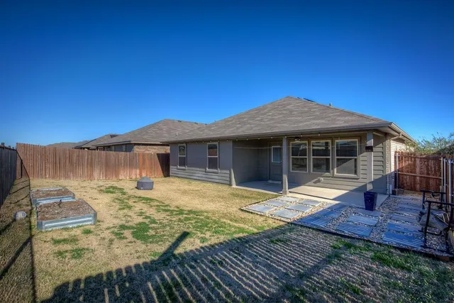 a front view of house with yard and seating area