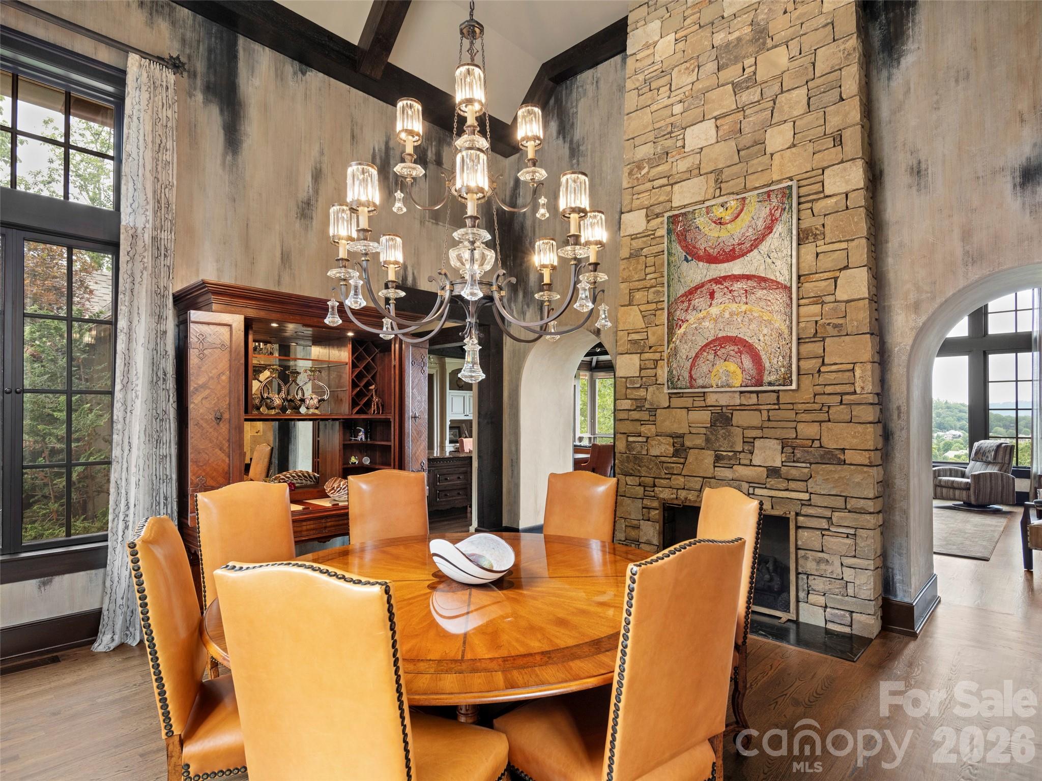 1929 Tree View Trail Arden, NC 28704 - Photo 24 of 48 a dining room with furniture a chandelier and wooden floor
