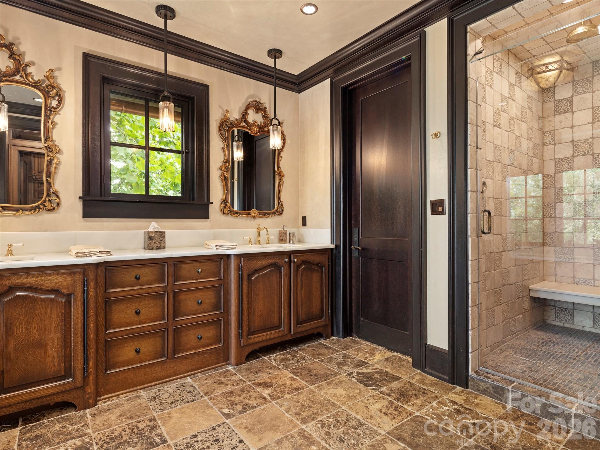1929 Tree View Trail Arden, NC 28704 - Photo 28 of 48 a bathroom with a sink a vanity and a mirror