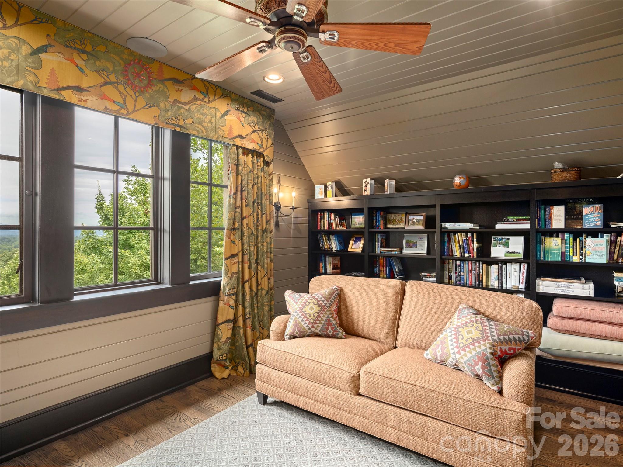 1929 Tree View Trail Arden, NC 28704 - Photo 29 of 48 a living room with furniture a ceiling fan and a rug