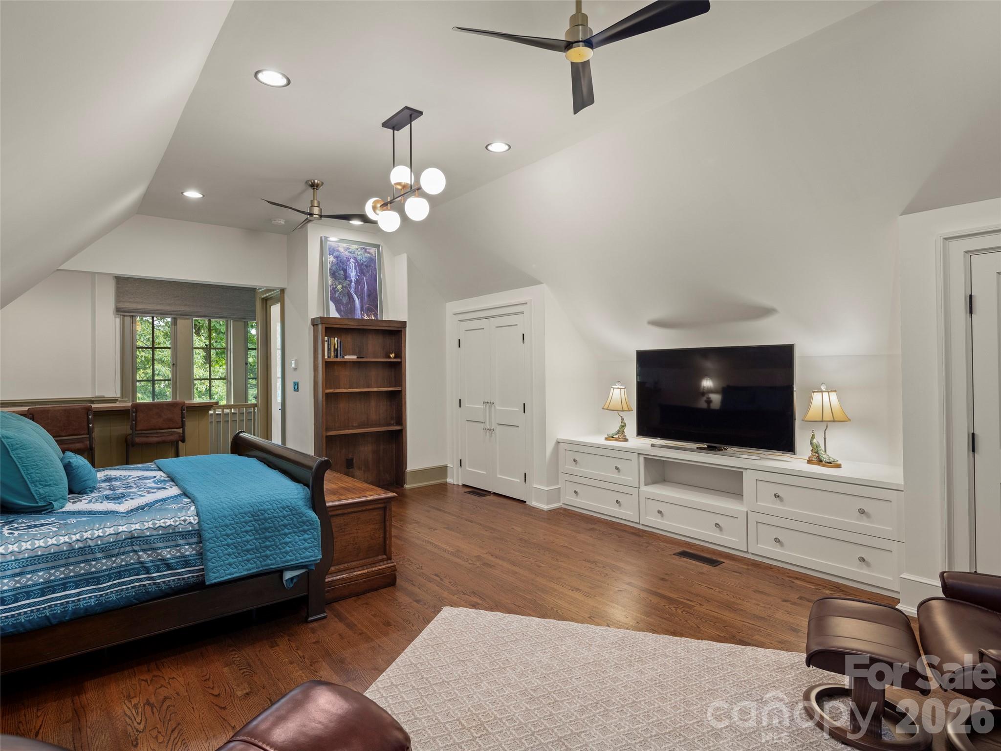 1929 Tree View Trail Arden, NC 28704 - Photo 30 of 48 a bedroom with a bed and a flat screen tv