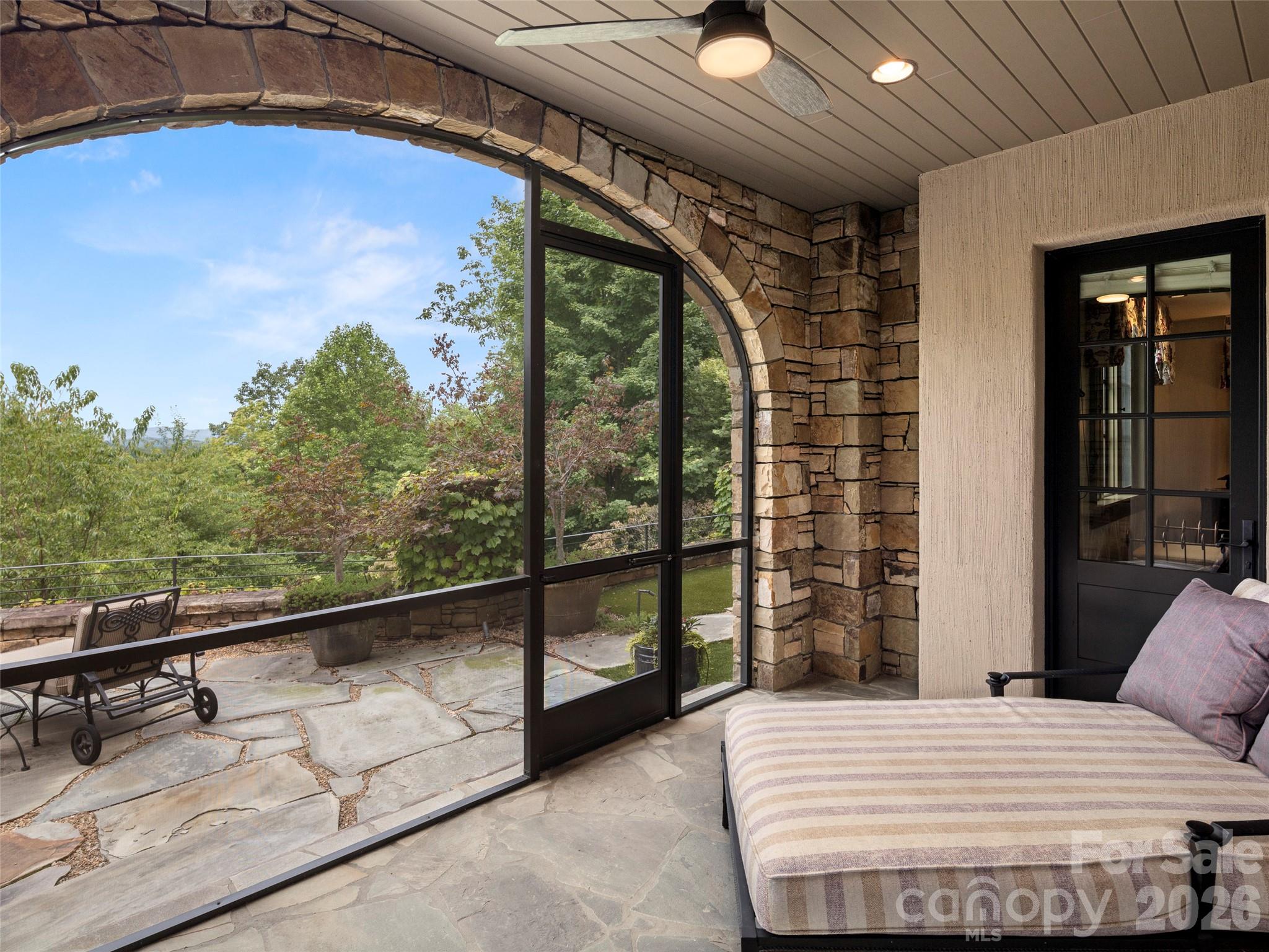 1929 Tree View Trail Arden, NC 28704 - Photo 38 of 48 a bedroom with a bed and a balcony view