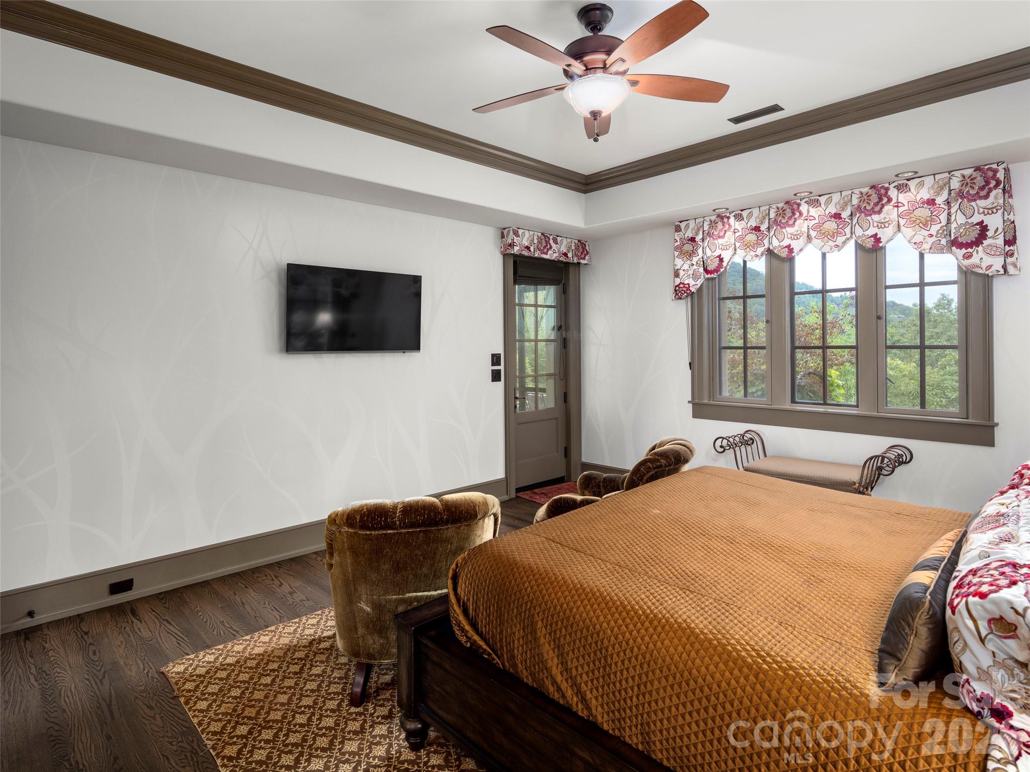 1929 Tree View Trail Arden, NC 28704 - Photo 39 of 48 a bedroom with a bed and a flat screen tv