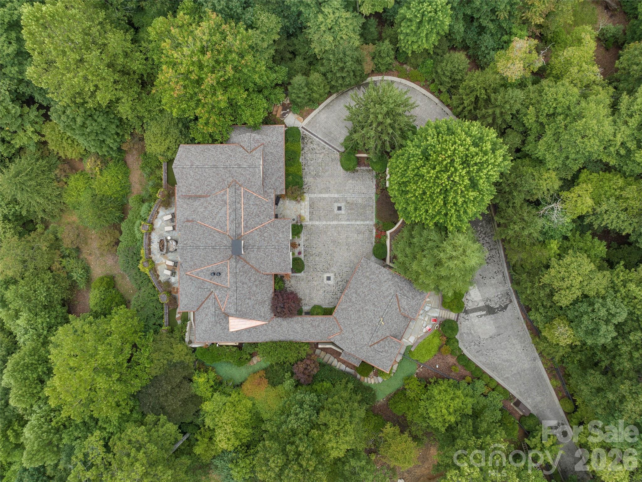 1929 Tree View Trail Arden, NC 28704 - Photo 42 of 48 an aerial view of a house with a yard and trees