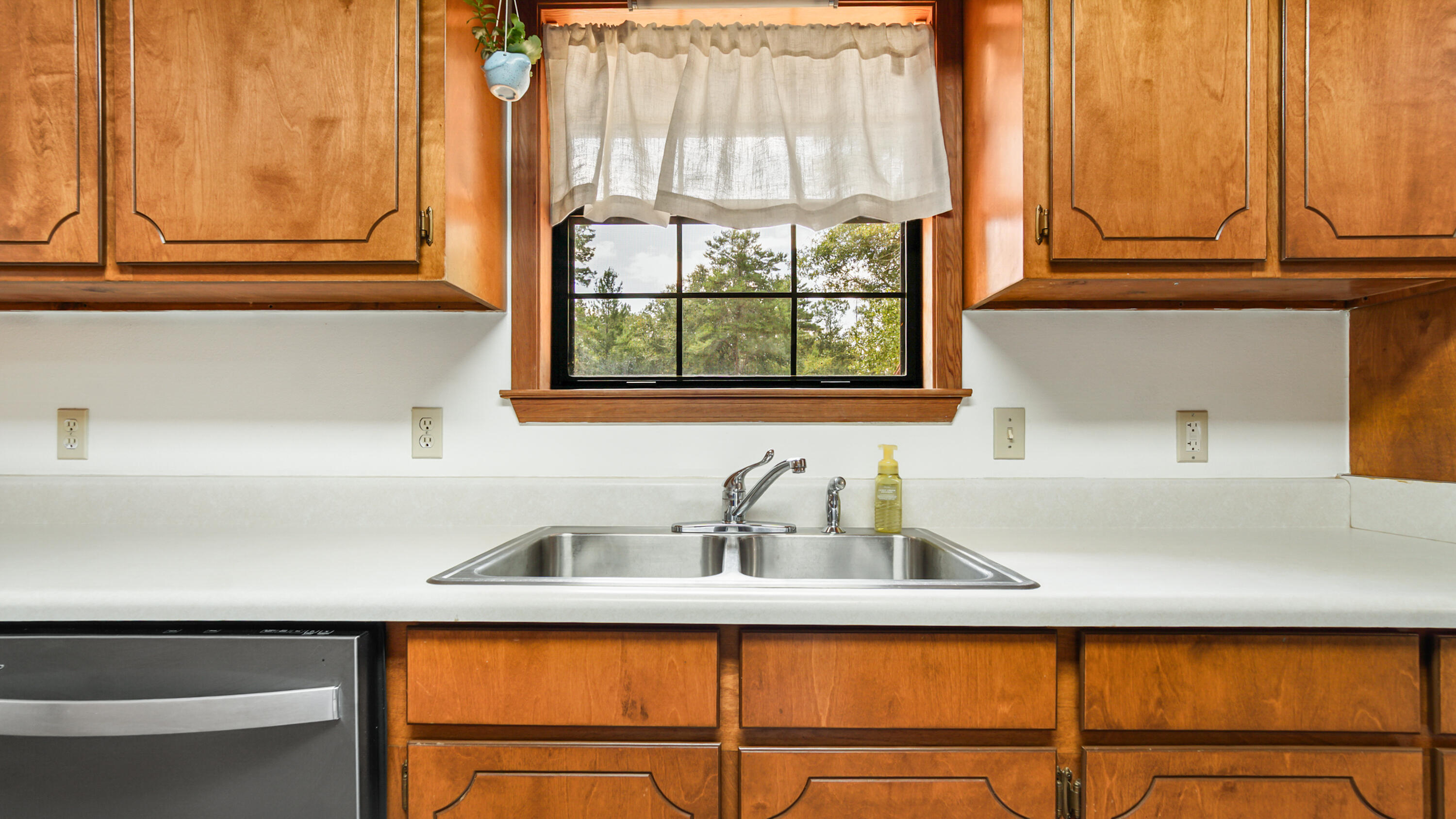 35 Marion Drive DeFuniak Springs, FL 32433 - Photo 11 of 38 a kitchen with appliances cabinets and a sink