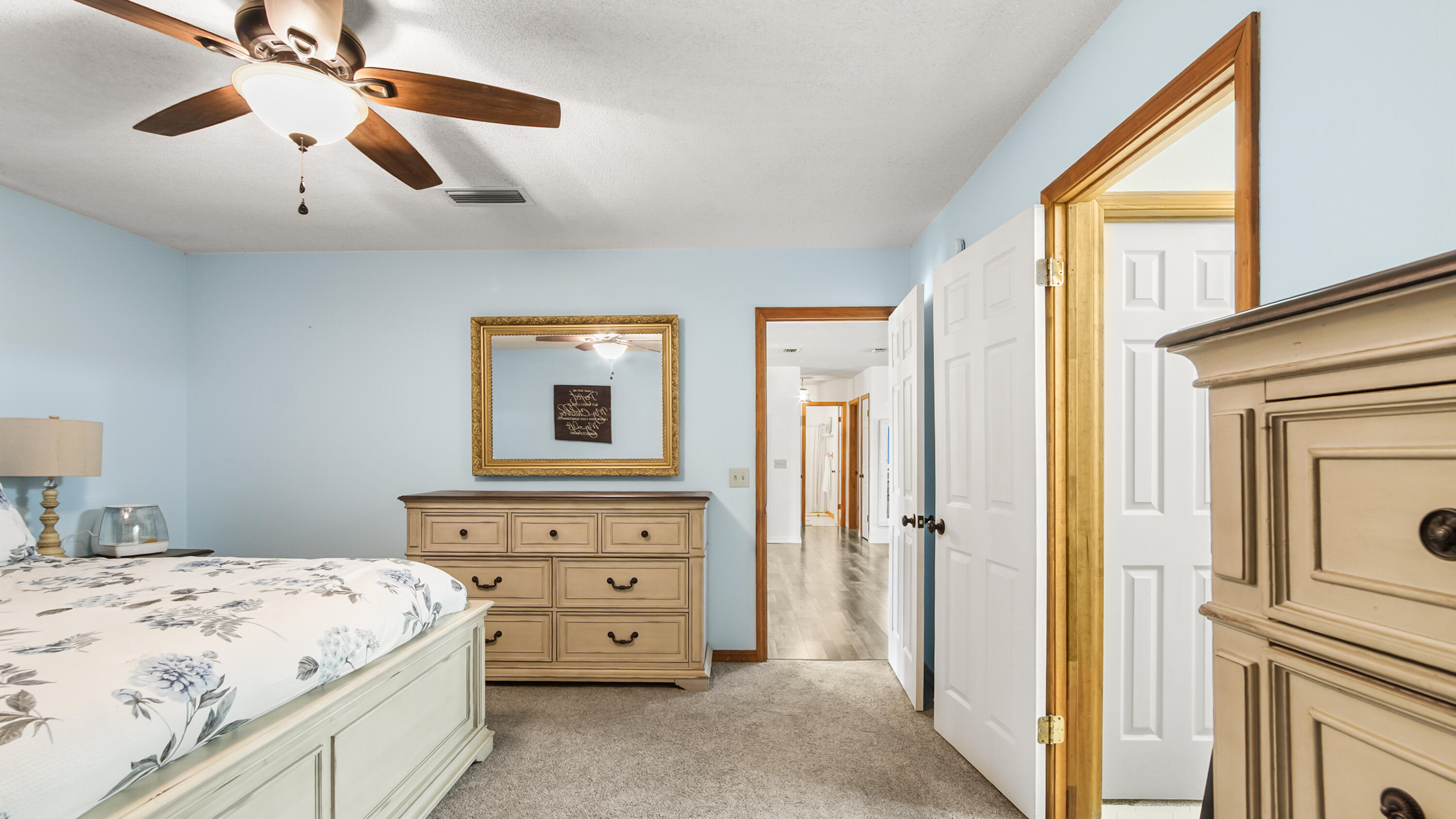 35 Marion Drive DeFuniak Springs, FL 32433 - Photo 12 of 38 a bedroom with a bed dresser and a window