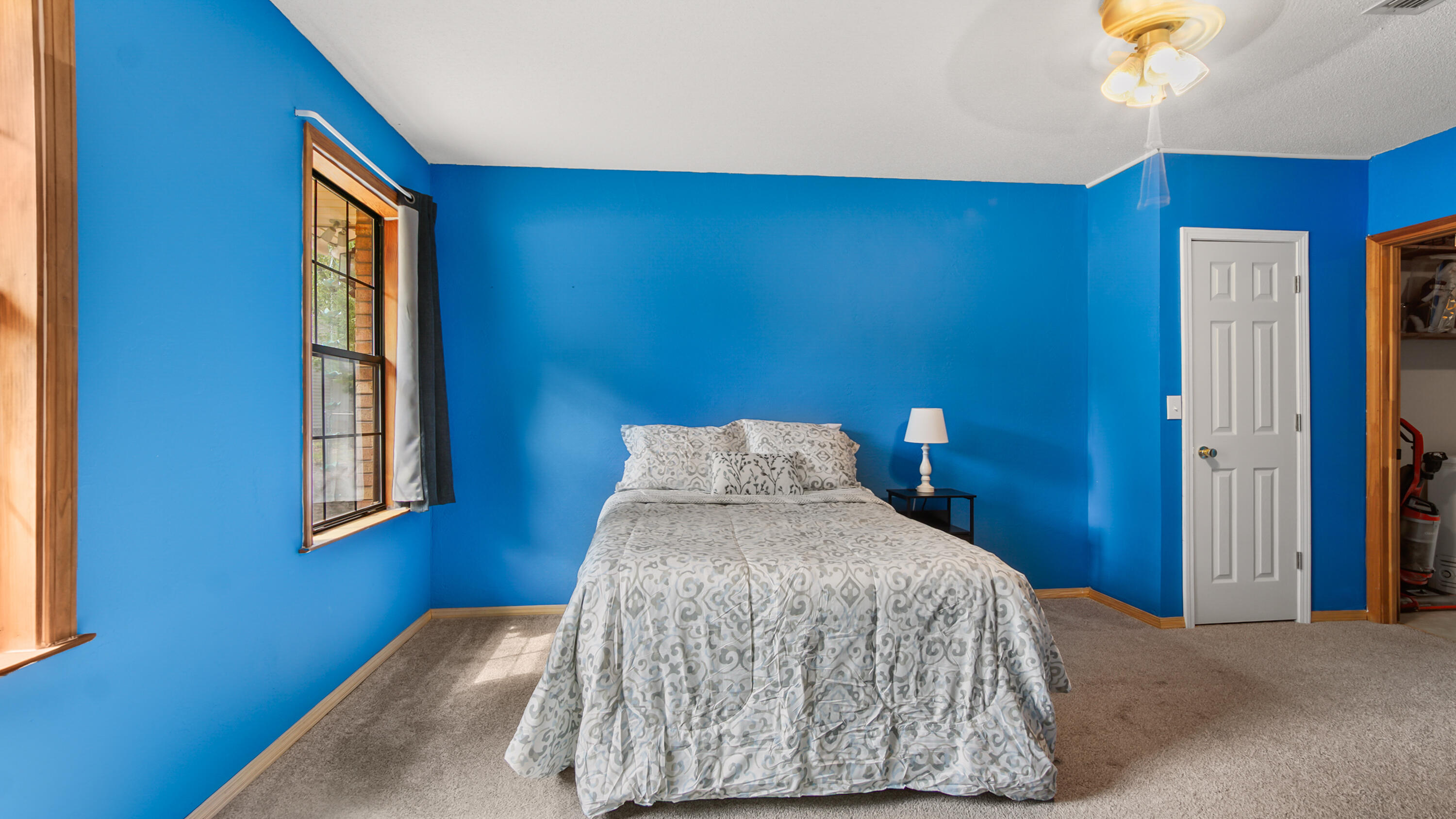 35 Marion Drive DeFuniak Springs, FL 32433 - Photo 17 of 38 a bed sitting in a bedroom next to a window