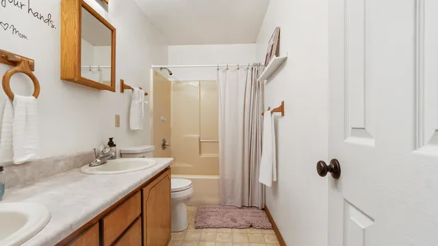 a bedroom with furniture and a chandelier