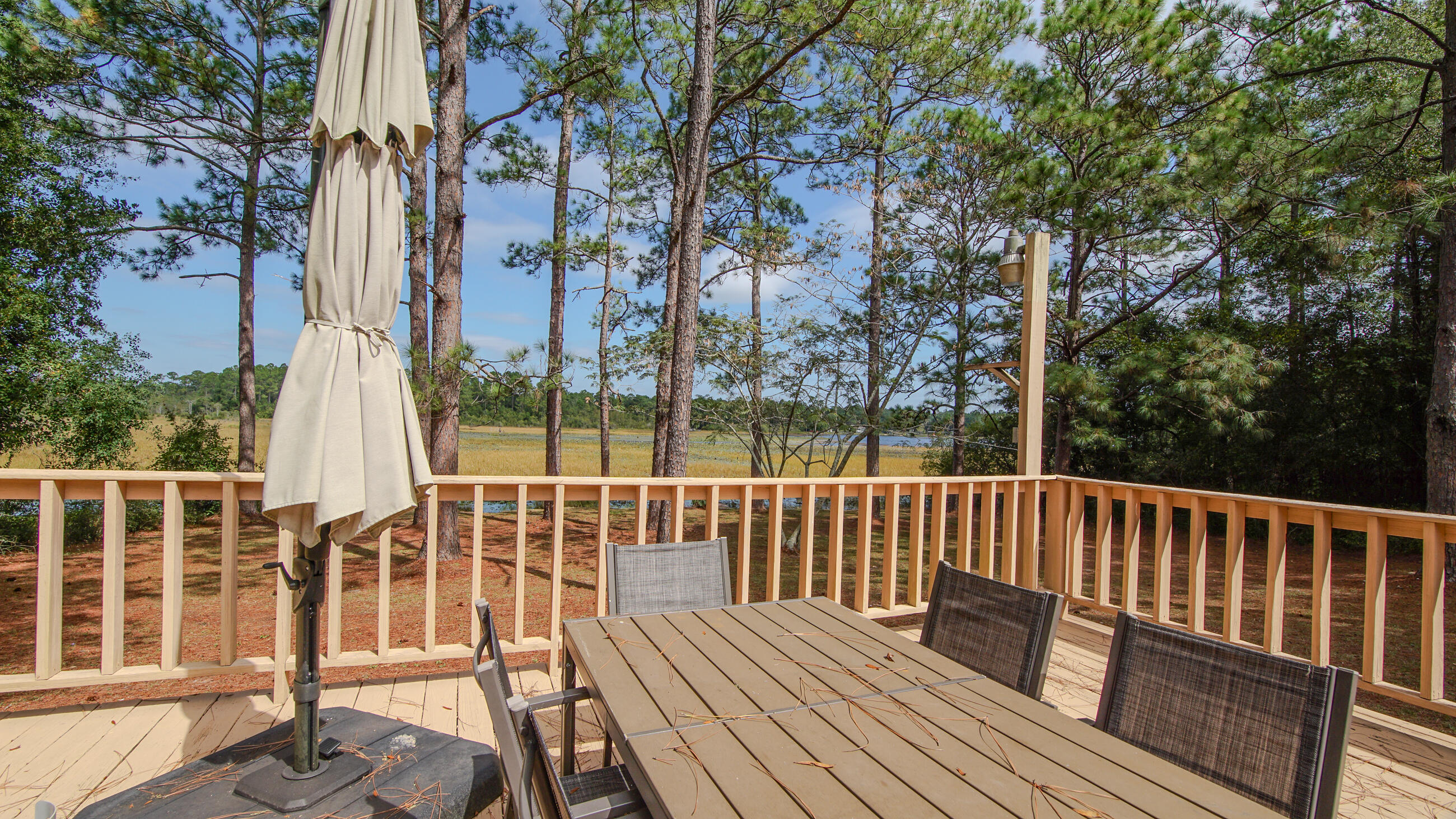35 Marion Drive DeFuniak Springs, FL 32433 - Photo 30 of 38 a view of balcony with wooden floor and fence