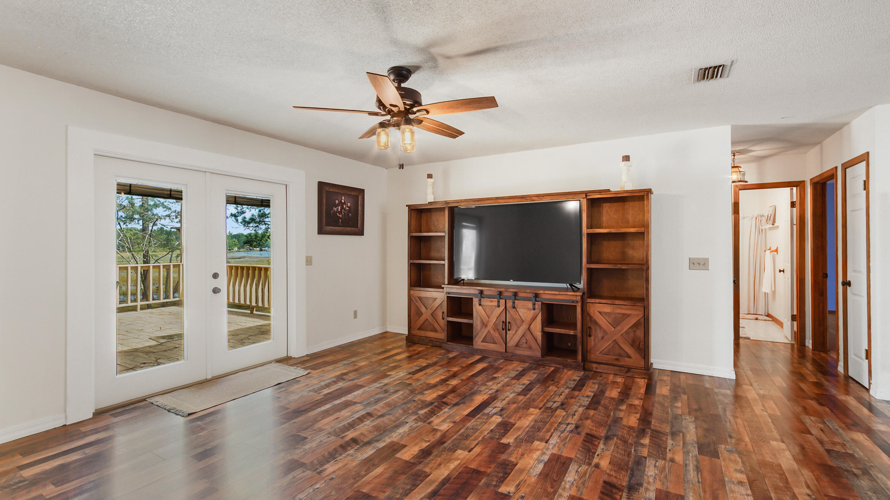 35 Marion Drive DeFuniak Springs, FL 32433 - Photo 7 of 38 a view of a livingroom with furniture and a flat screen tv
