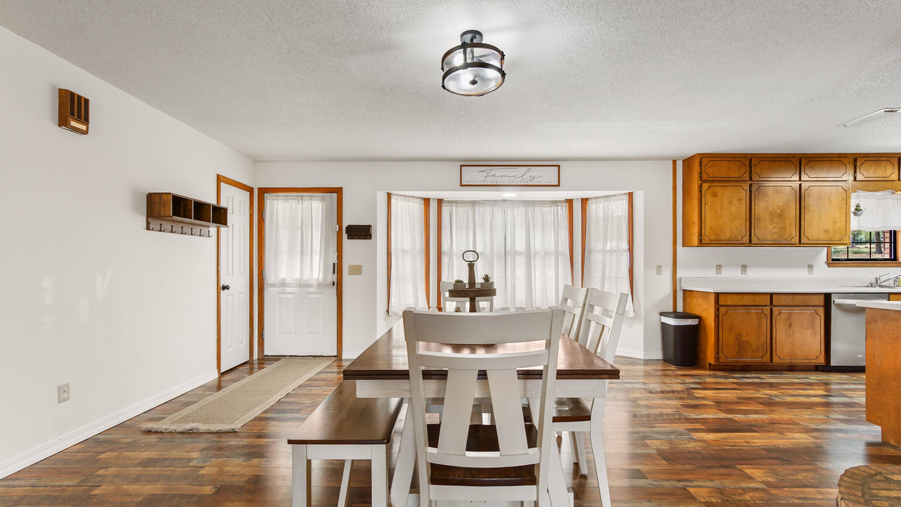 35 Marion Drive DeFuniak Springs, FL 32433 - Photo 8 of 38 a view of a dining room with furniture window and wooden floor