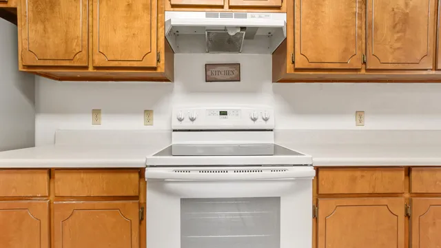 a kitchen with appliances cabinets and a sink