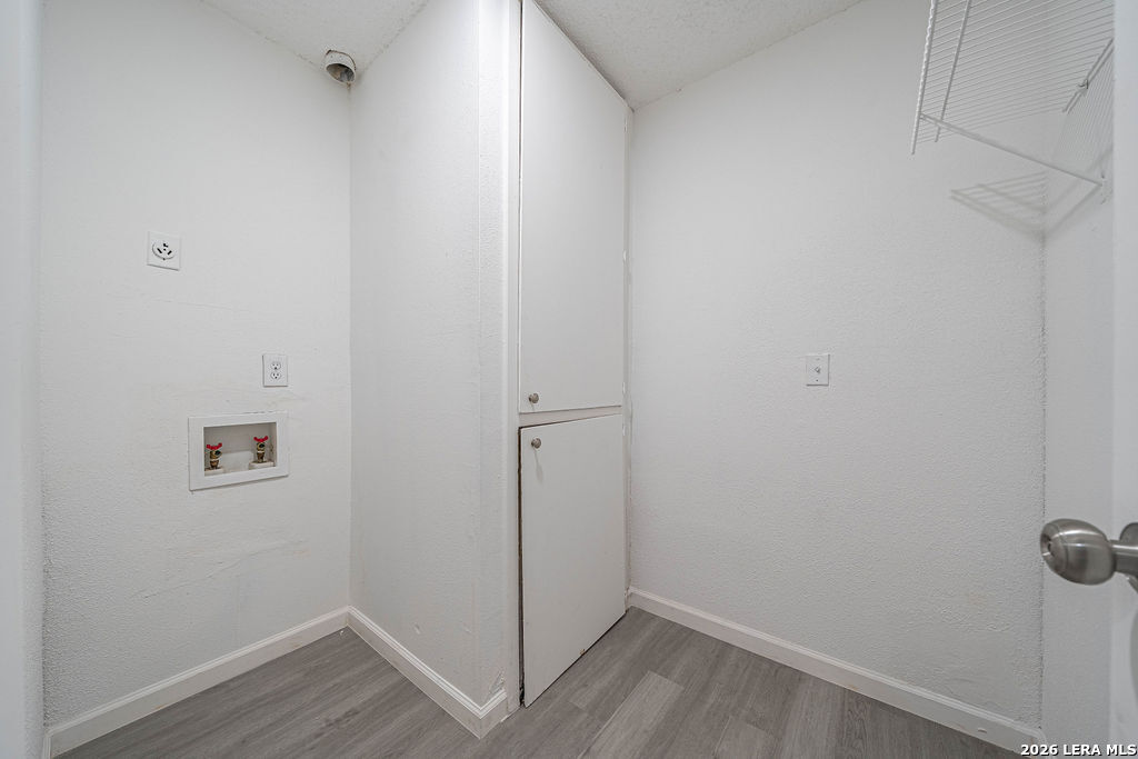 9131 Valley Ridge San Antonio, TX 78250 - Photo 11 of 12 a view of a room with wooden floor