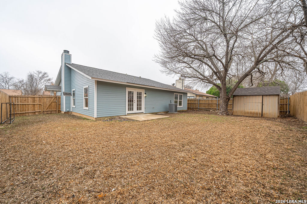 9131 Valley Ridge San Antonio, TX 78250 - Photo 12 of 12 a house with trees in front of it