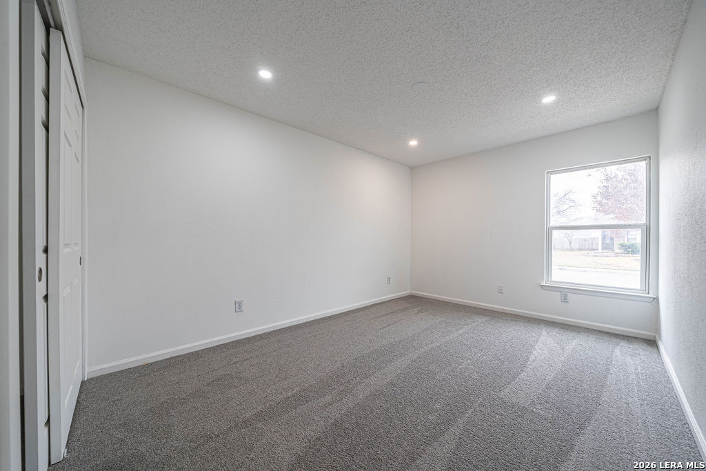 9131 Valley Ridge San Antonio, TX 78250 - Photo 5 of 12 an empty room with a empty space and a window