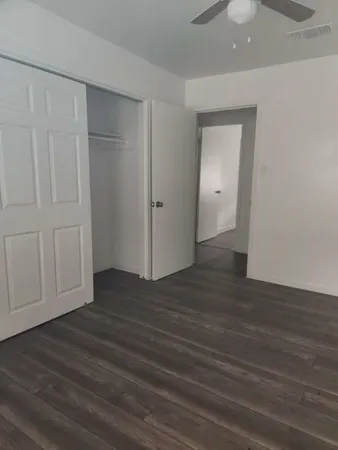 a view of a livingroom with wooden floor