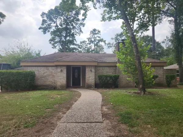 a view of a house with yard and a garden