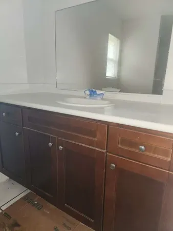a bathroom with a sink and vanity